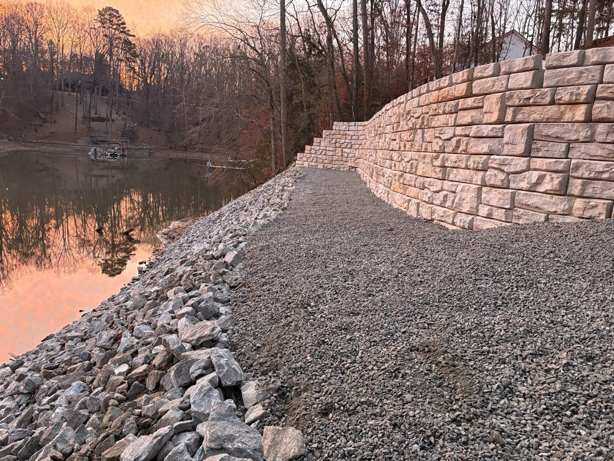 Completed large-block retaining wall at sunset on Lake Keowee, SC